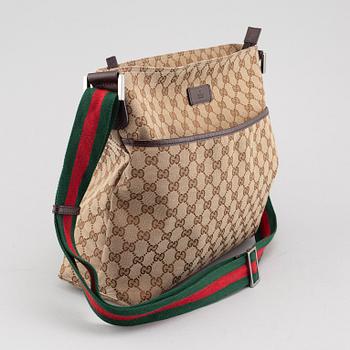 GUCCI, a "Messenger" bag.