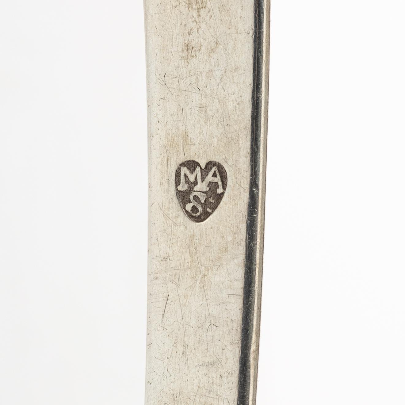 Two silver serving spoons with pseudo-marks, around the year 1900.