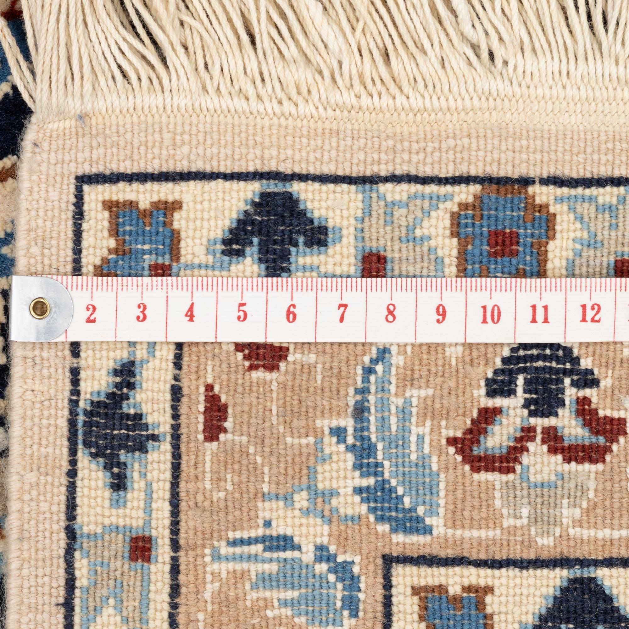 A Nain rug, part silk, c. 128 x 82 cm.