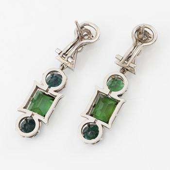 A pair of earrings in 18K white gold with tourmalines and round brilliant-cut diamonds.