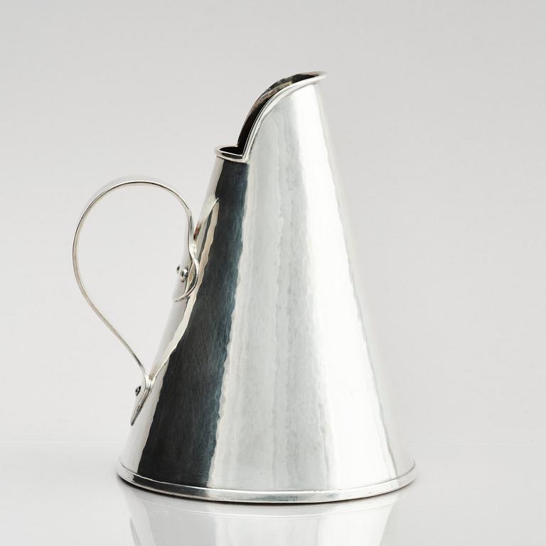 G H Markenius, a silver pitcher with handle, Stockholm 1957.