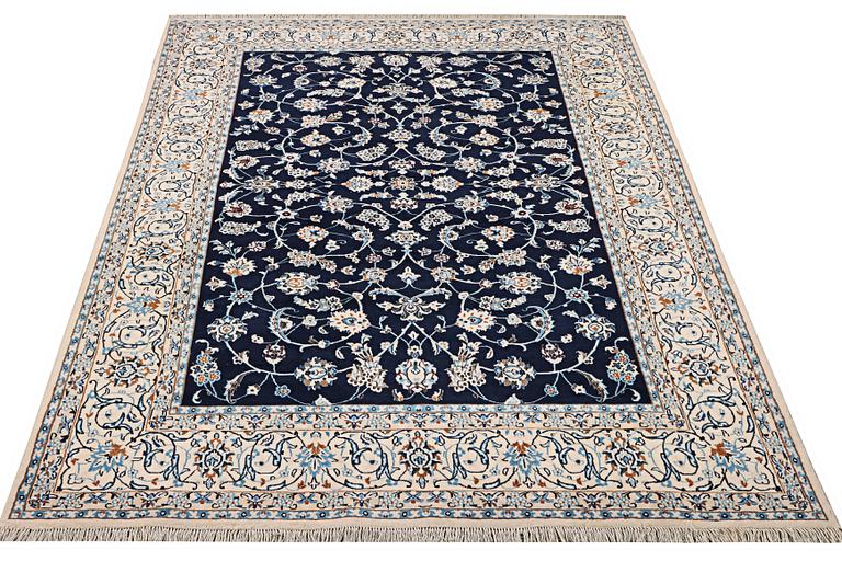 A part silk Nain rug, 9LA, c. 302 x 198 cm.