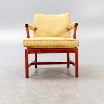 A Josef Frank walnut armchair Firma Svenskt Tenn model nr 667.