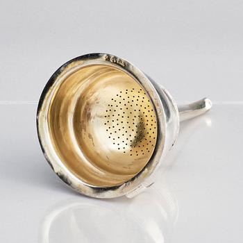 A Swedish 19th century parcel-gilt silver wine-strainer, mark of C.N. Ruthenbeck, Uddevalla (1828-1854).