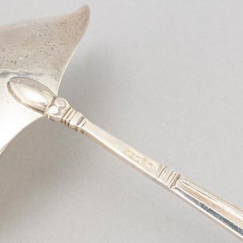 Johan Rohde, an 'Acorn' sterling sauce ladle, Georg Jensen post 1945 + a Danish silver serving spoon, Copenhagen 1931.