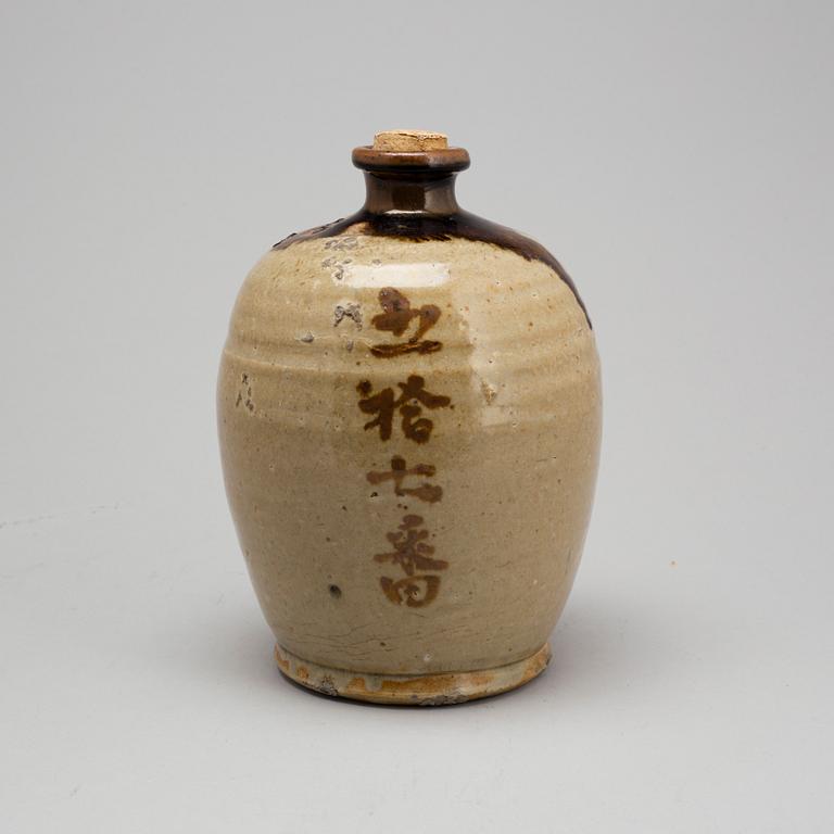 A Japanese glazed ceramic 'tokkari' sake bottle, presumably 18th century.