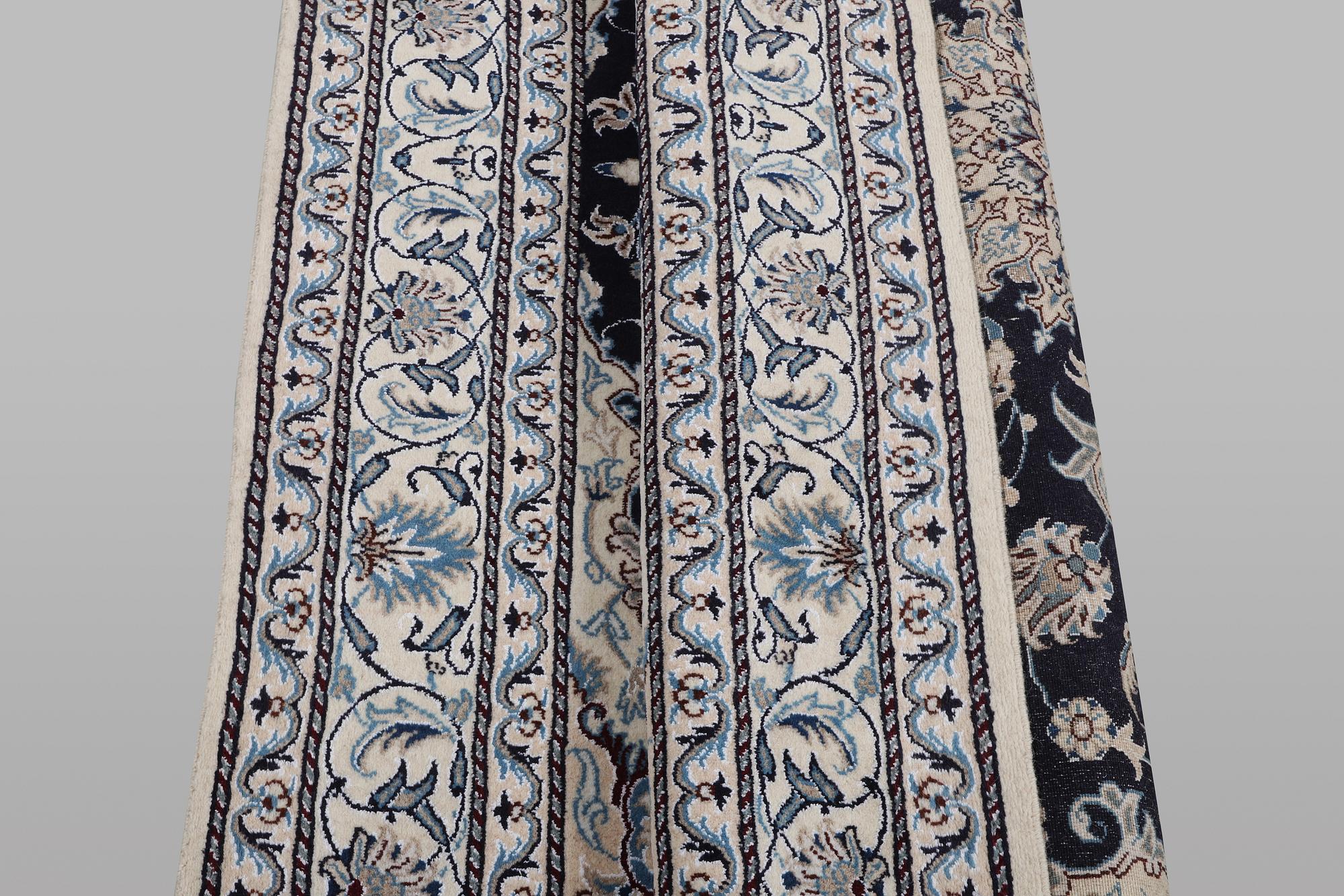 A rug, Nain, part silk, ca 198 x 144 cm.