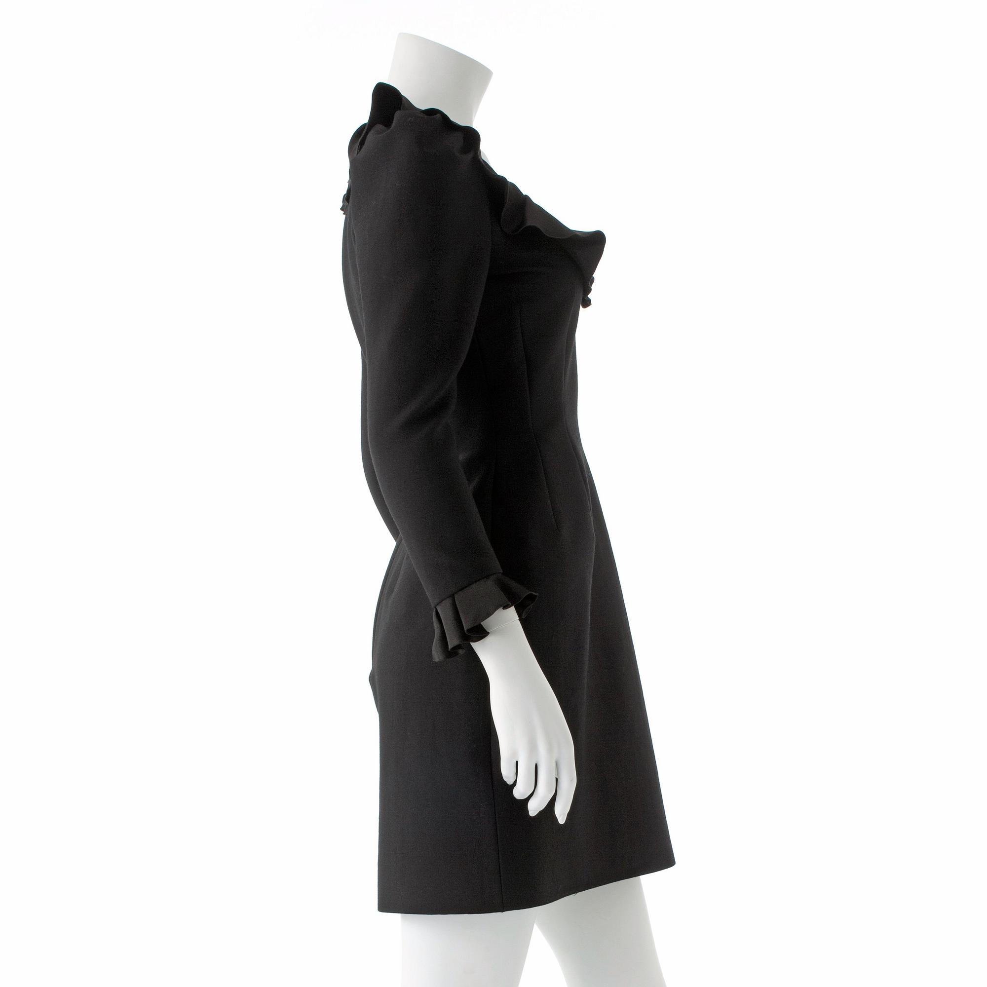 LANVIN, a black wool blend dress with ruffles.