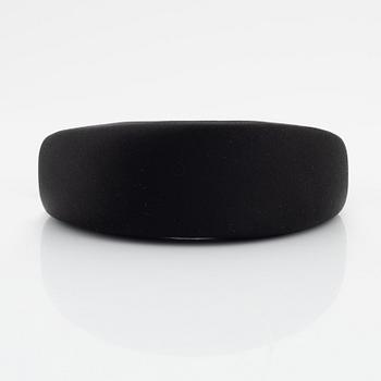 Prada, a black silk hair accessory.