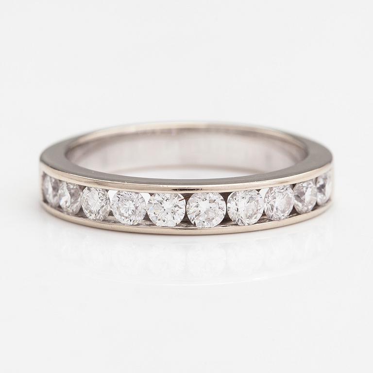 An 18K gold eternity ring with brilliant cut diamonds 1.0 ct in total according to engraving.