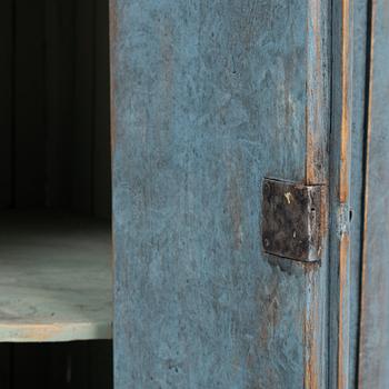 A painted corner cabinet, late 19th century.