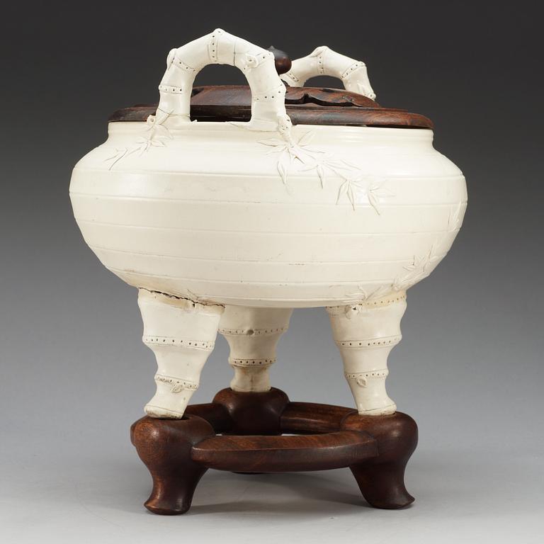 A large white glazed ceramic tripod censer, Qing dynasty, 19th Century, with Chenghua six character mark.