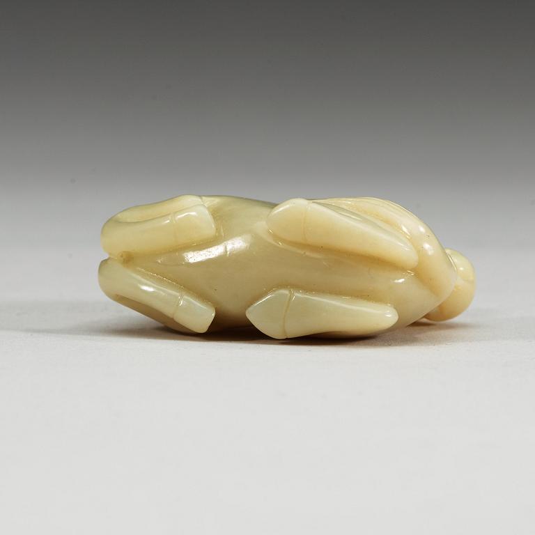 A nephrite figure of a reclining horse with a monkey, China.