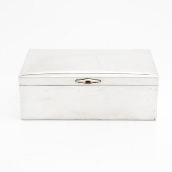 A silver cigarette box by K Anderson, Stockholm, 1907.