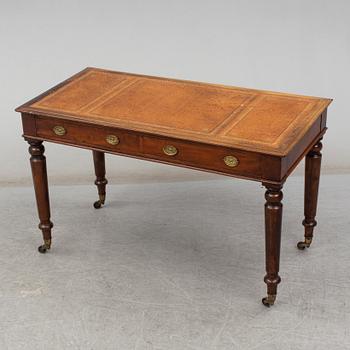 A late 19th century English writing table signed Holland & Sons.