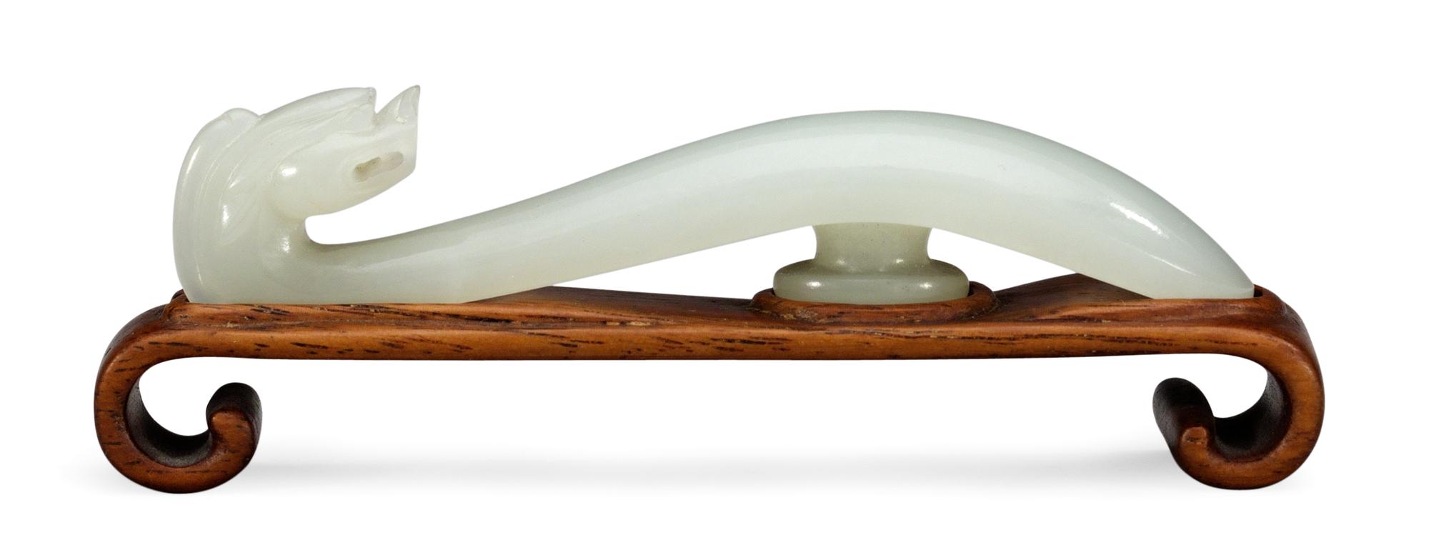 A Chinese jade belt clasper.