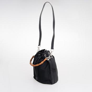 GUCCI, a black nylon handbag.