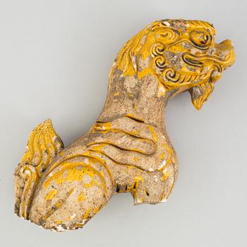A yellow glazed fragment of a rooftile, Ming dynasty (1368-1644).