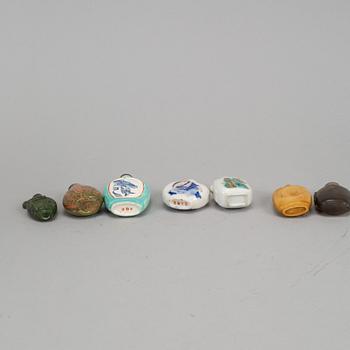 A group of seven stone, ceramic and porcelain snuff bottles, Qing dynasty and China, 19th-20th century.