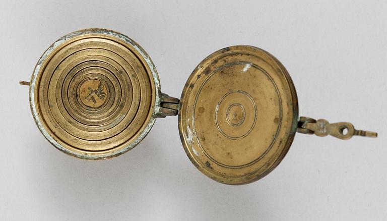 A brass set of measure, marked 1822.