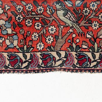 An antique/semi-antique pictoral Kashan rug, ca 215 x 140-144 cm.