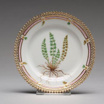 A set of 12 Royal Copenhagen "Flora Danica" bread dishes, Denmark, 20th Century.