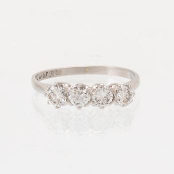 A platinum ring set with round brilliant-cut diamonds, Gothenburg 1962.