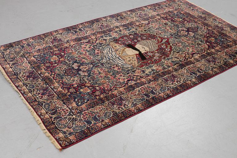 A carpet, semi-antique Kerman Laver, ca 242 x 142 cm.