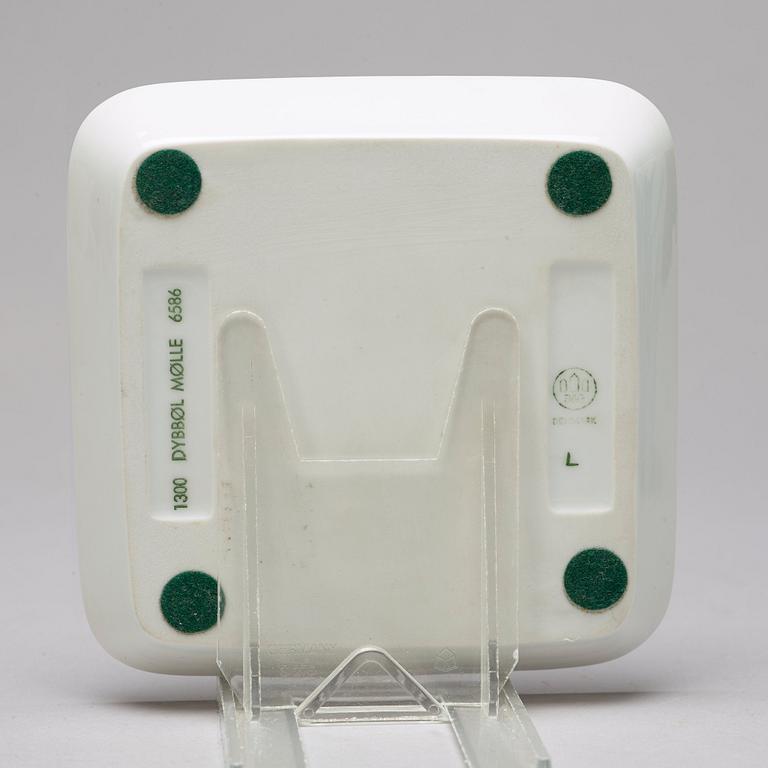 BING & GRÖNDAHL and ROYAL COPENHAGEN, a set of three porcelain vases and a dish, Denmark.