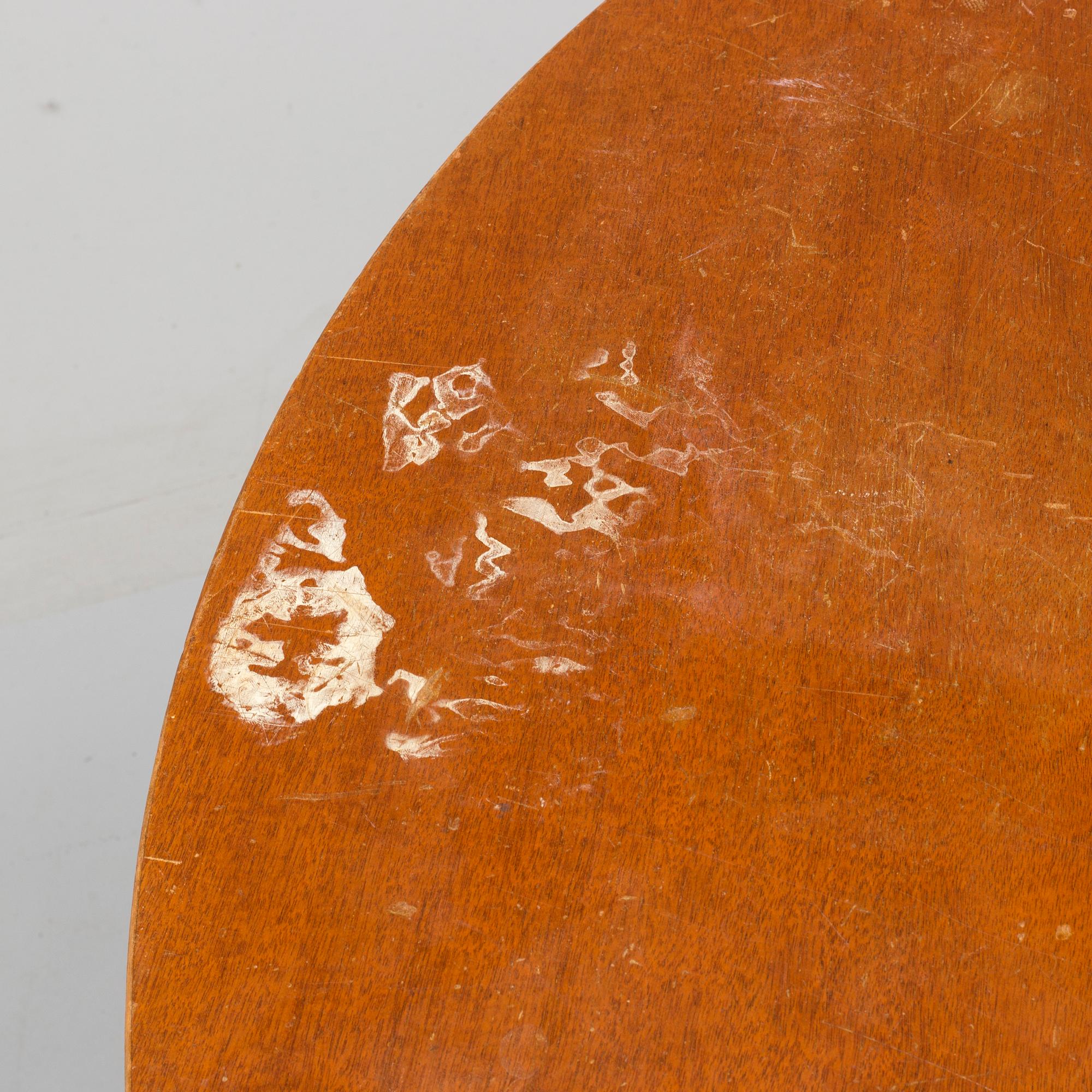A 1940s mahogany veneer table.