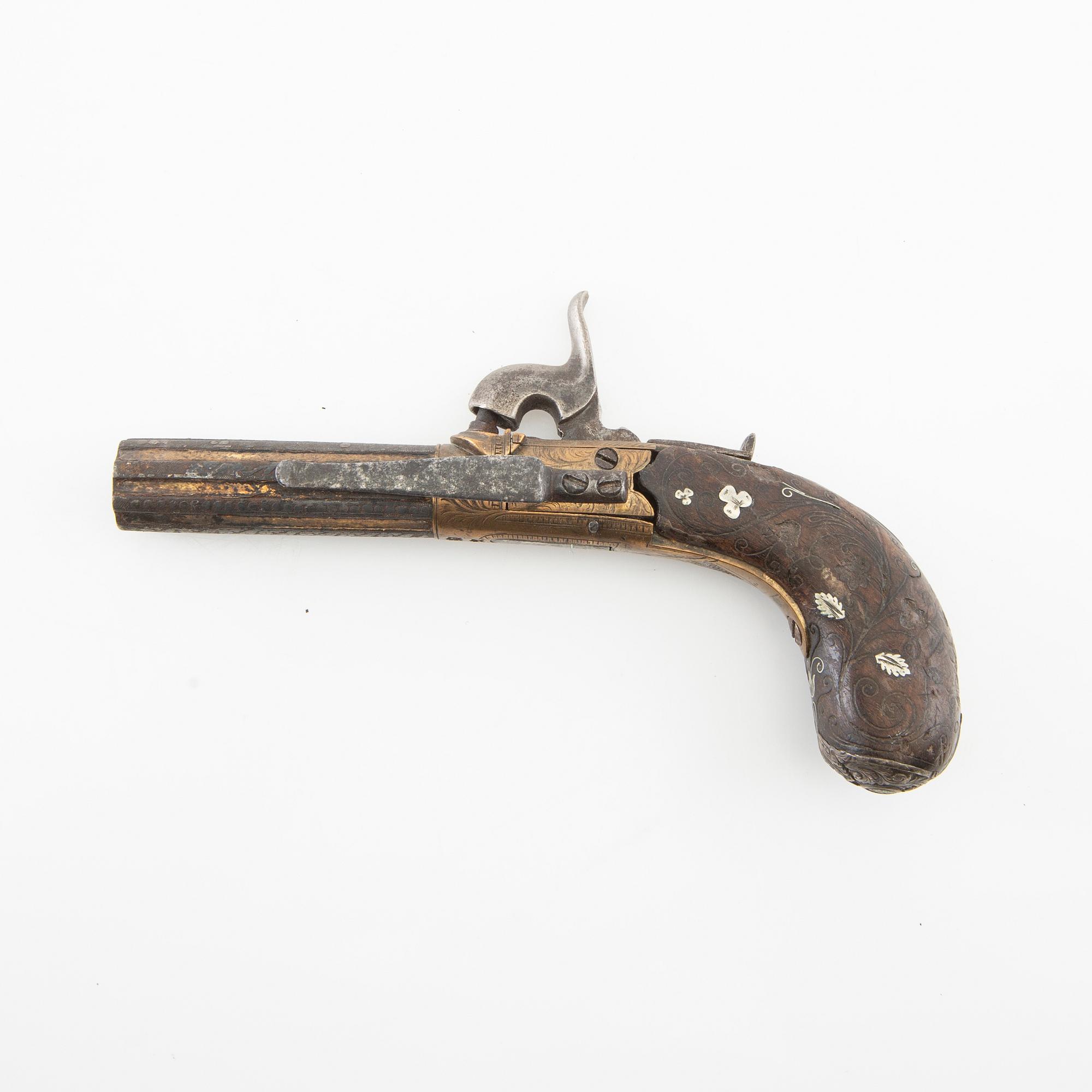 A British percussion pistol, 19th century.
