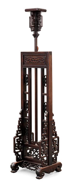 A hardwood lantern stand, with carved stylized dragons, presumably late Qing dynasty.