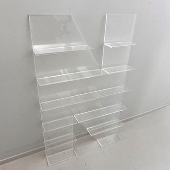 Shelf, plexi glass, in the shape of the letter 'N', Non Violence.