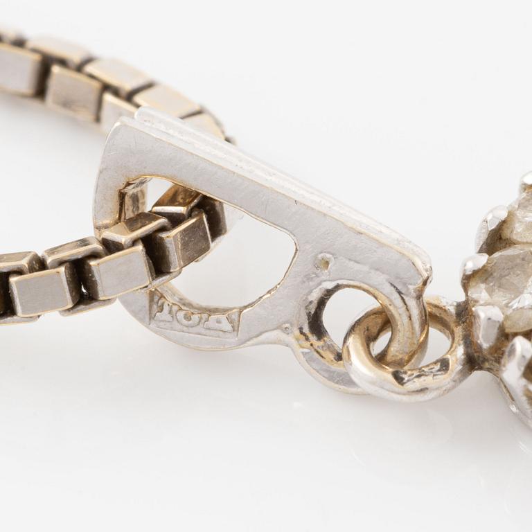 Pendant, 18K white gold set with brilliant-cut diamonds, and chain.