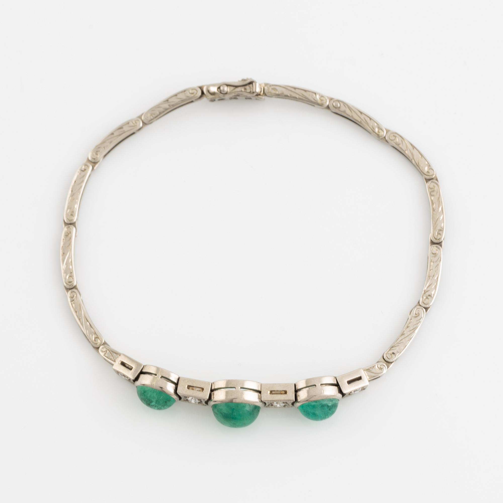 Cabochon cut emerald and brilliant cut diamond bracelet.