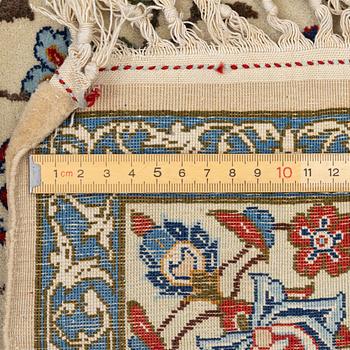 A Nain rug, c. 165 x 103 cm.