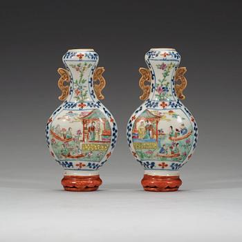 310. A pair of famille rose wall vases, late Qing dynasty, circa 1900.