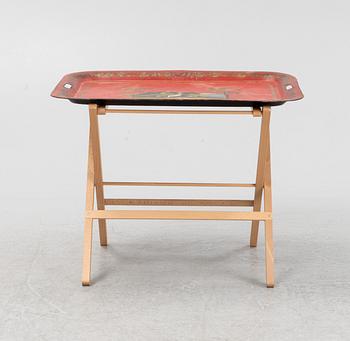 A painted 19th Century tin tray with later stand.