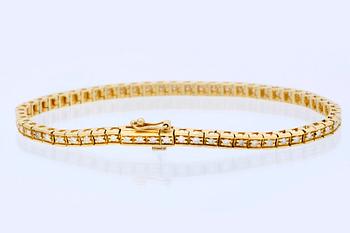 Tennis bracelet 18K gold with brilliant-cut diamonds approx 0,90 ct in total, length approx 19 cm.