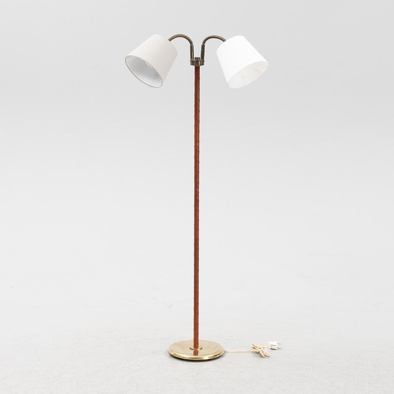 A mid 20th Century double headed floor lamp.