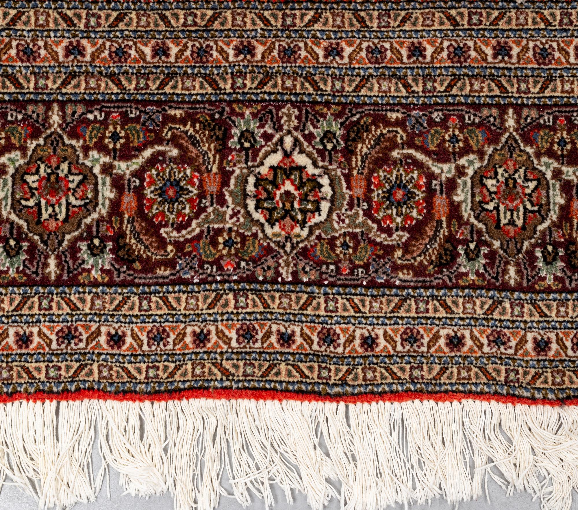 A carpet, Tabriz, part silk, 40-50 Radj, ca 300 x 195 cm.