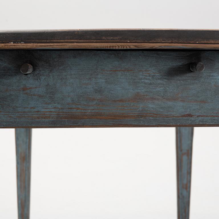 A mid 19th Century table with a drawer.