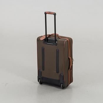 A LONGCHAMP SUITCASE.