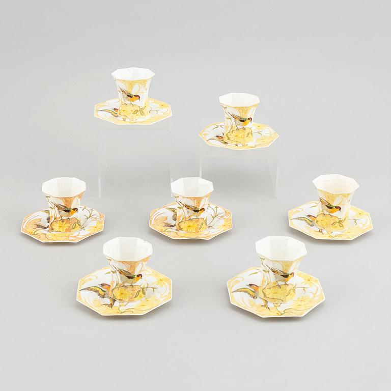 Rozenburg den Haag, seven egg shell porcelain cups and saucers, Holland, early 20th Cnntury.