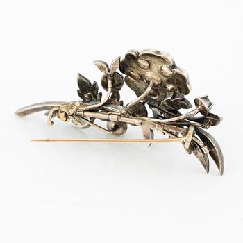 Brooch, in the shape of a floral sprig, silver with rose-cut diamonds.