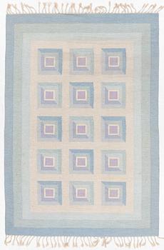 A flat weave rug, c. 240 x 163 cm.