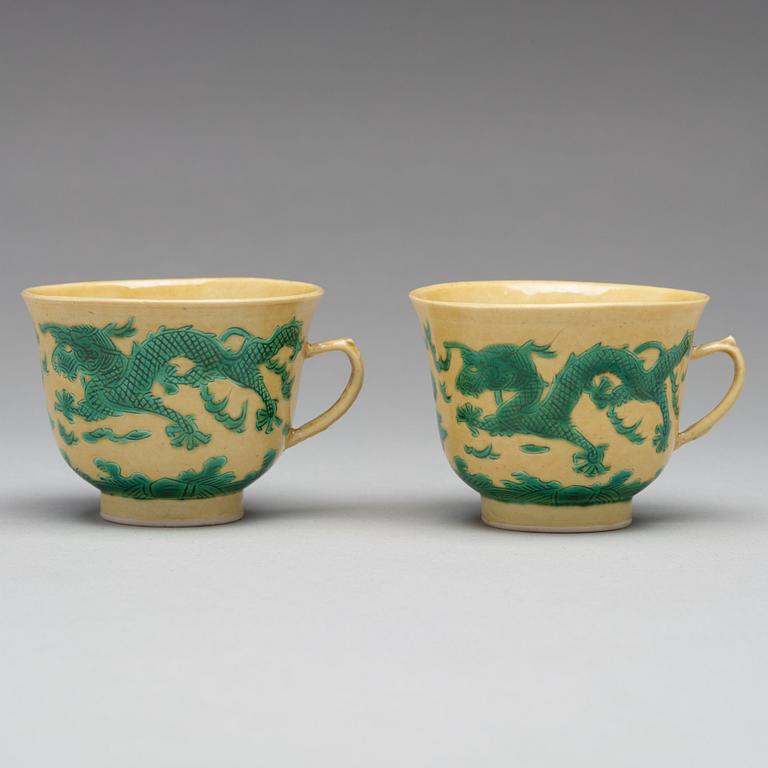 A pair of yellow glazed tea cups with stands, Qing dynasty with Guangxus six character mark (1875-1908).