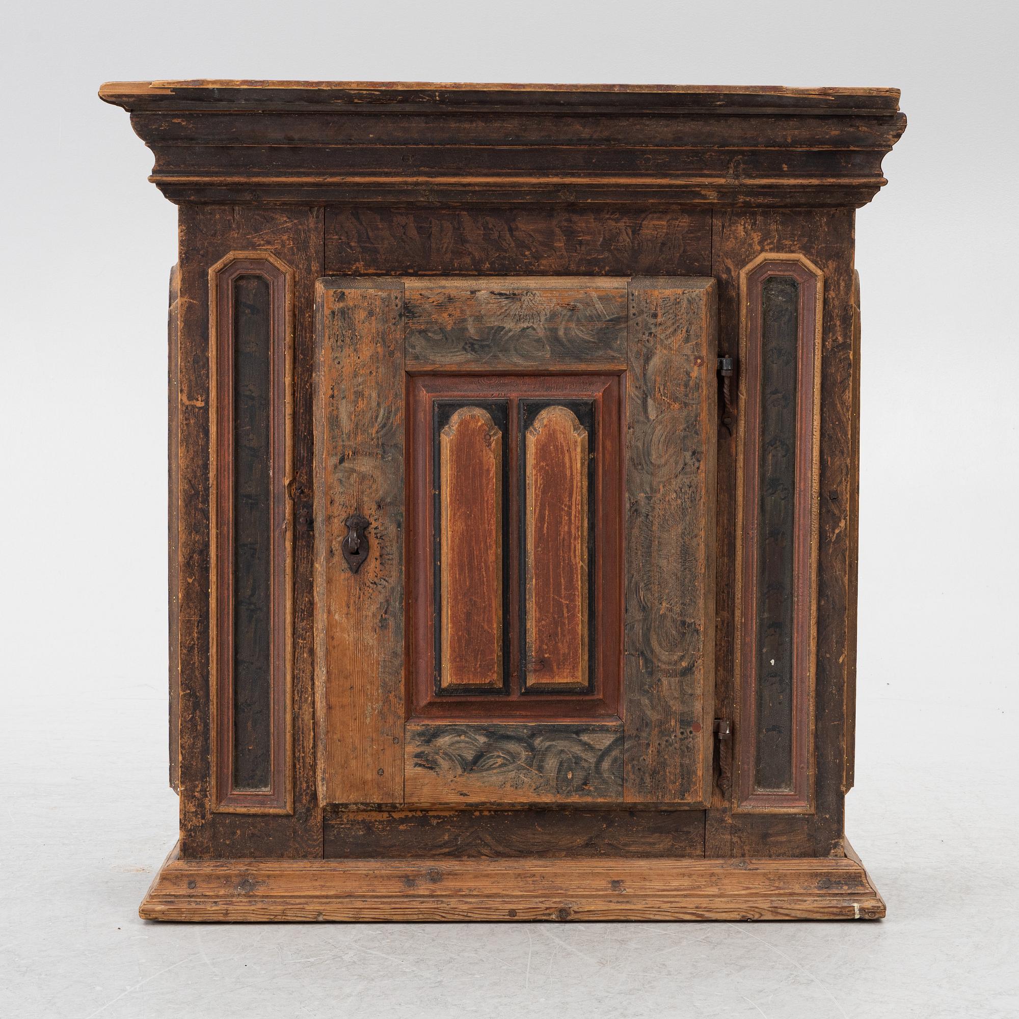 A polychrome-painted folk art hanging cabinet from Järvsö, Sweden, early 19th century.