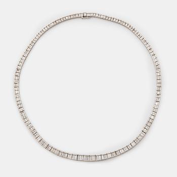 1072. A platinum necklace set with tapered baguette-cut diamonds.