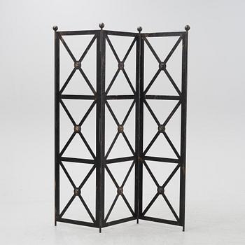 An contemporary open iron folding screen.